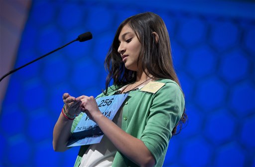 Vismaya Kharkar, 14, of Bountiful, Utah works on the word "stultiloquence" before spelling it correctly during the semifinal round of the National Spelling Bee, Thursday, May 30, 2013, in Oxon Hill, Md. (AP Photo/Evan Vucci)